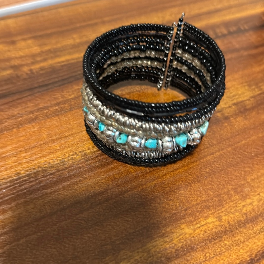 Beaded, Black, Silver and Turquoise colored bead bracelet.